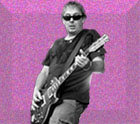 fuscia speckled and embossed background with black and white image of guitarist Brain Baker