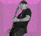 fuscia speckled and embossed background with black and white image of bass player Randy Bradbury