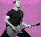 fuscia speckled and embossed background with black and white image of band leader Mike Ness